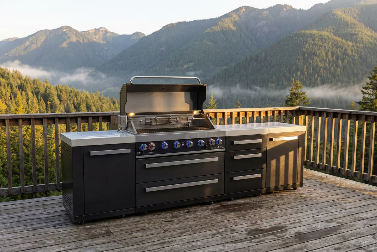 Mont Alpi MAi805-BSSDR Black Series outdoor kitchen with extra drawers, hood open in an outdoor setting